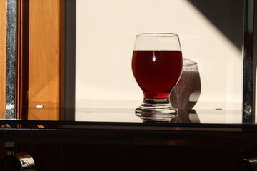 glass of red wine on table
