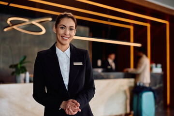 Portrait of smiling female hotel manager looking at camera.