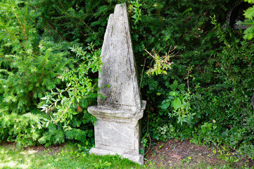 Old  grave stone on a tomb. Cemetery.