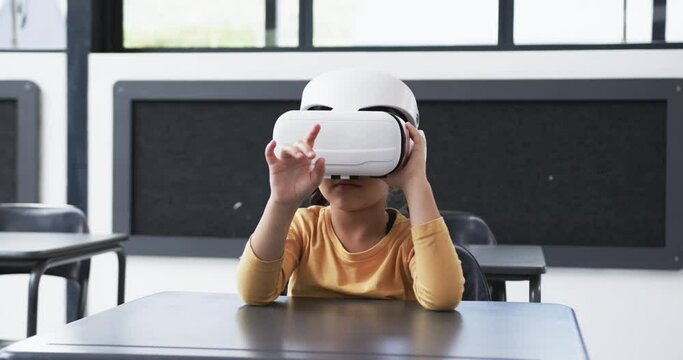 In a school, a young biracial student explores virtual reality