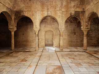 Interior view of the Arabic Baths El Banuelo, in Granada Spain. Sunlight entering the ceiling. Old...