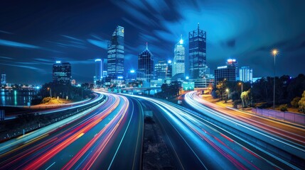 Obraz premium City at night, with its iconic skyline illuminated against a deep blue sky, featuring a bustling highway overpass adorned with motion-blurred cars traversing the scene.