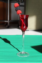 red cocktail on the table