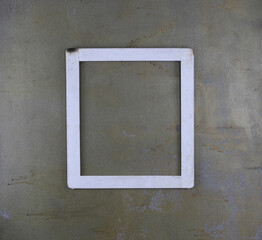 simple wooden frame on a concrete wall