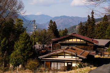 Fototapeta na wymiar Tsumago, Japan - March 21 2016: Tsumago town daytime and japanese traditional village houses