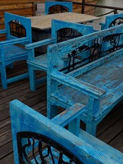 blue wooden benches - obrazy, fototapety, plakaty