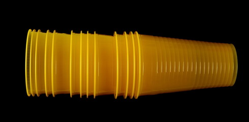 Empty new yellow disposable plastic cup isolated on black, clipping path - 764291660