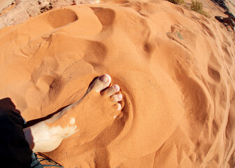 Foot in the red sand