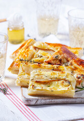 Puff pastry pie with cheese, pears, nuts and honey, served with champagne. - 764294849