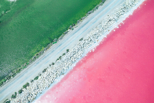 Aerial view on pink water Saline Aigues Mortes, Camargue France
