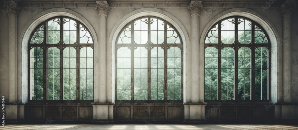 Poster capture the essence of a close-up view of a room featuring three expansive windows and a simple benc