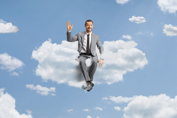 Businessman floating on a cloud