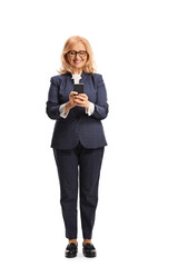 Happy middle aged businesswoman using a smartphone and smiling