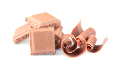 Delicious chocolate shavings and pieces isolated on white