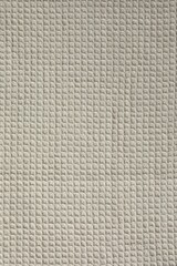 Fototapeta na wymiar Texture of beige knitted fabric as background, top view