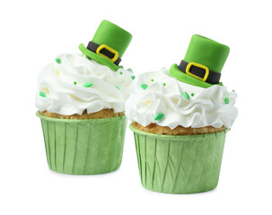 St. Patrick's day party. Tasty cupcakes with green leprechaun hat toppers and sprinkles isolated on...