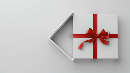 Gift box with red ribbon isolated on white background, copy space, aerial view 