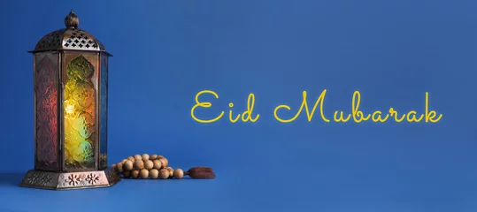Foto op Canvas Eid Mubarak banner. Arabic lantern and misbaha on blue background © New Africa