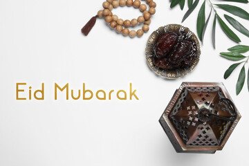 Eid Mubarak greeting card. Flat lay composition with Arabic lantern and misbaha on white table