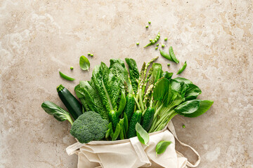 Green vegetable background. Various green vegetables in a shopping bag. Veggies. Shopping food supermarket and clean eating, healthy vegetarian, vegan food concept, delivery food, copy space, top view - 764315486