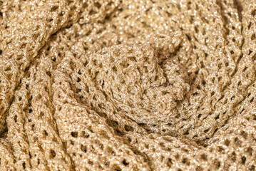 Twisted pleated knit fabric with golden thread