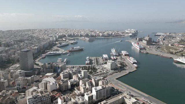 This footage was made with a drone, at the morning, with the panorama of Piraeus Port and the neighborhood , which is located in Athens, near the sea. A lot of buildings, cruise ships, boats