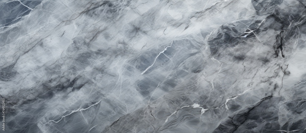 Poster an image featuring a detailed view of a black and white marble surface against a backdrop with the s