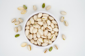 Pistachio nuts in a white bowl