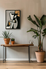 A modern wooden console table against the wall with potted plants and an art poster in the style of maximalist, with warm beige tones, a minimalist interior design concept