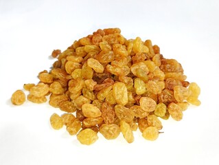 Currant fruit on a white background. Pile the dried raisins on a clear plate 