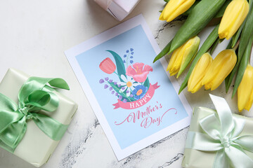 Festive postcard with gift boxes and yellow tulips on white grunge background. Happy Mother's Day