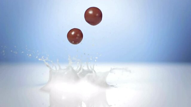  Super Slow-Motion: Chocolate Balls Splashing Into Milk in 4K Ultra HD Resolution