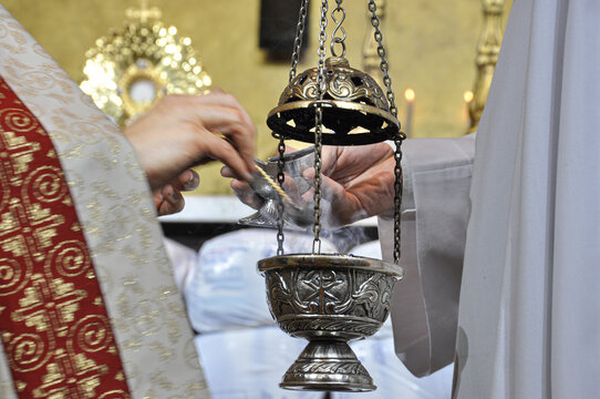 The priest takes insense from the vessel and places it in the thurible to be offered at the Altar, where the Blessed Sacrament is located to be adored.