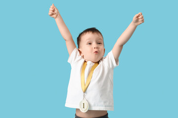 Cute little athlete with first place medal celebrating success on blue background - Powered by Adobe