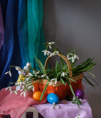 A still life arrangement of Easter eggs, spring flowers. Still life with snowdrops and ester eags. - 764363629