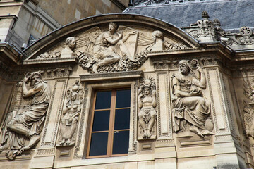 Fototapeta na wymiar Some architectural details of the building that houses the Louvre museum in Paris, France, one of the most famous museums in the world