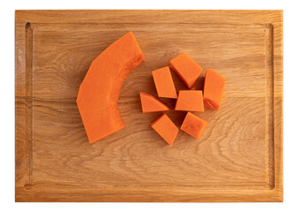 pieces of pumpkin on wooden board isolated