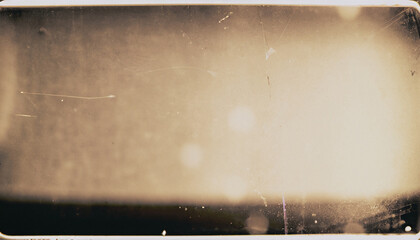 Dusty scratched and scanned old film texture or overlay with soft focus; sepia for vintage color effect