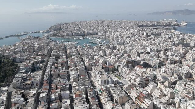This footage was made with a drone, at the morning, with the panorama of University of Piraeus and the neighborhood , which is located in Athens, near the sea. A lot of buildings, in the frame
