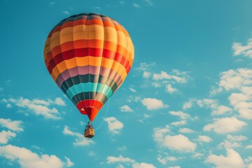A colorful hot air balloon is floating in the sky