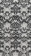 Fotobehang  white lace pattern against black background, floral design. concepts: designer backgrounds and textures, storytelling, backdrop for elegant themes, wedding accessories, lace in fashion, handmade item © Indi