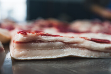 closeup shot of a pork thin slice on the table, butchers shop. High quality photo