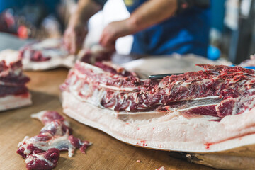 meat preparing process at the butchers shop, working on the meat. High quality photo