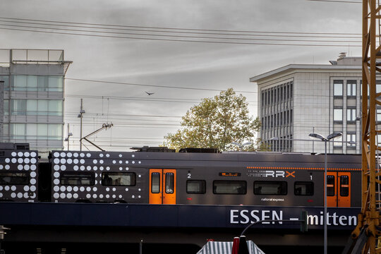 ESSEN, GERMANY - NOVEMBER 11, 2022: RRX Train departing from Essen Hbf a transportation hub of NRW region of Germany, part of Rhein Ruhr Express system with the Essen slogan.