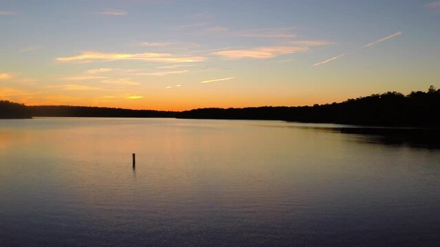 Aerial Forward Ascending Idyllic Shot Of Rippled River Amidst Trees No Landscape At Sunset - Buckner, California