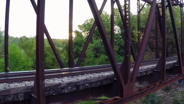 Aerial: Drone Panning Shot Of Tranquil Truss Bridge Against Clear Sky - Buckner, California