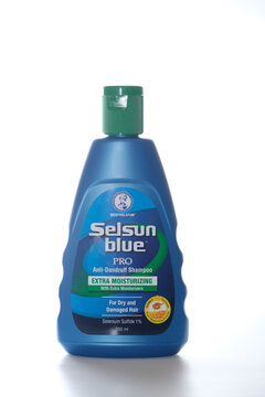 Kuala Lumpur Malaysia - March 2024. Buying Selsun Blue Extra Moisturizing for dry and damaged hair for daily use at Guardian Malaysia