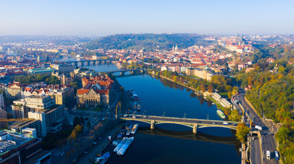 Fototapeta na wymiar Picturesque view from drone of Prague on banks on Vltava river, capital and largest city of Czech Republic on fall day