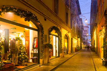 Fototapeta na wymiar View on lanes with Christmas illumination in night Parma of Italy outdoors.