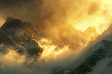 Photograph of the top part of a mountain range in fog with golden light shining through, with a...